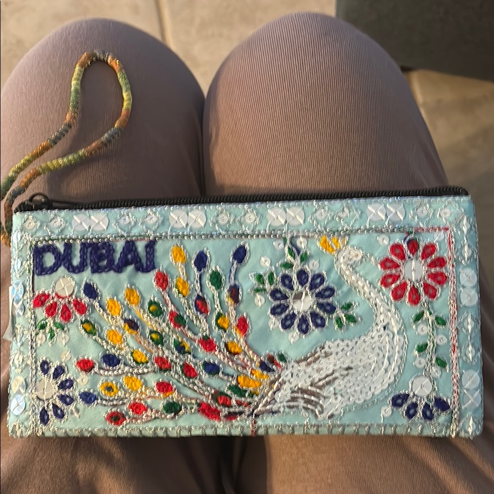 Vibrant Blue and Red Clutch with Floral Embroidery